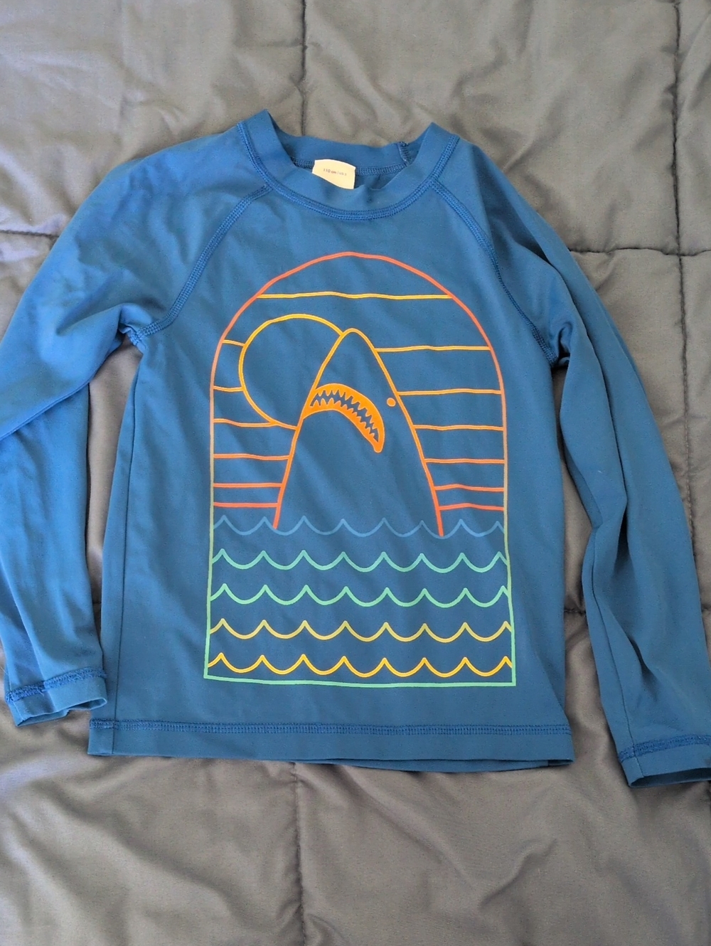 Hanna Andersson Blue Rashguard with Orange, Yellow and Teal Graphic